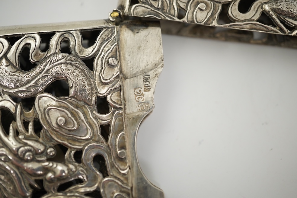 A late 19th century Chinese Export pierced silver card case, maker KMS(Kwong Man Shing), decorated with dragons amid clouds, 10.4cm, together with a Chinese Export pierced silver octagonal box and cover, by Luen Wo?, cir